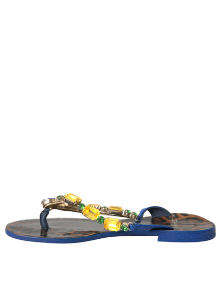 a pair of blue sandals with yellow and green beads