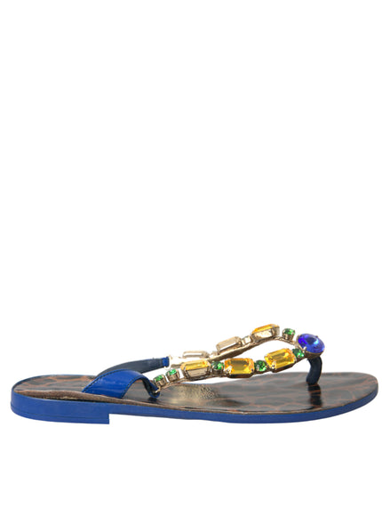 a pair of sandals with beads on them