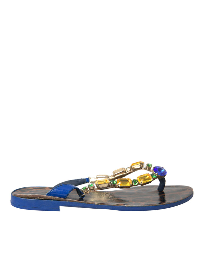 a pair of sandals with beads on them