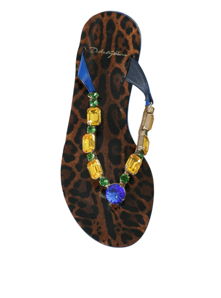 a pair of sandals with a beaded necklace