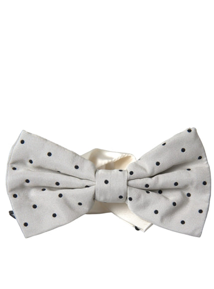 a white bow tie with black polka dots