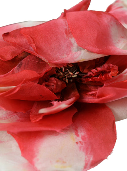 Close-up of red floral applique on headband