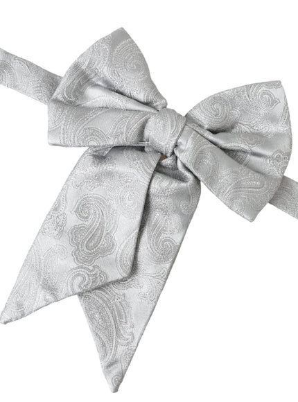 a white bow with a paisley pattern on it