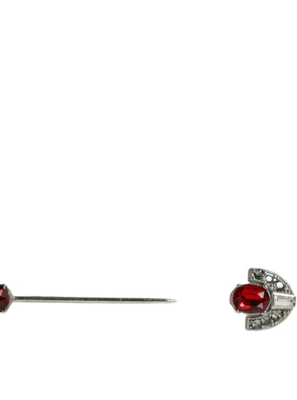 a pair of red and white diamond earrings