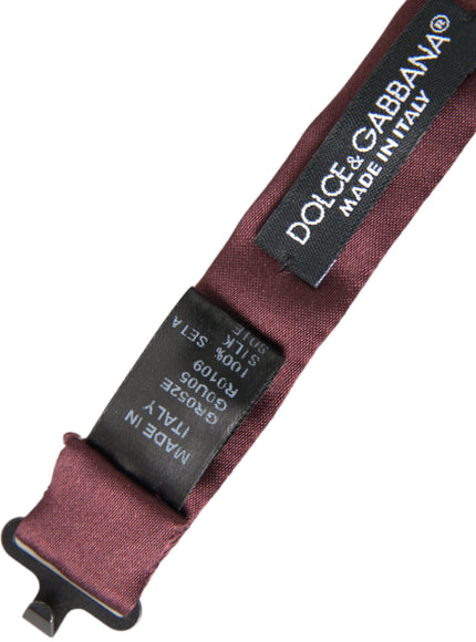 a close up of a red belt with a tag on it