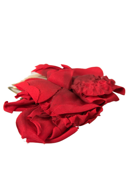 a pile of red cloth sitting on top of a white table