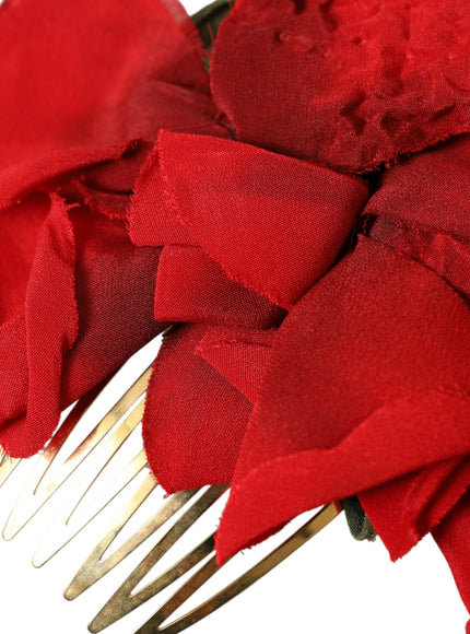 a close up of a hair comb with red fabric on it