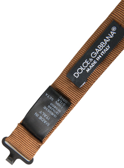 a brown belt with a black tag on it