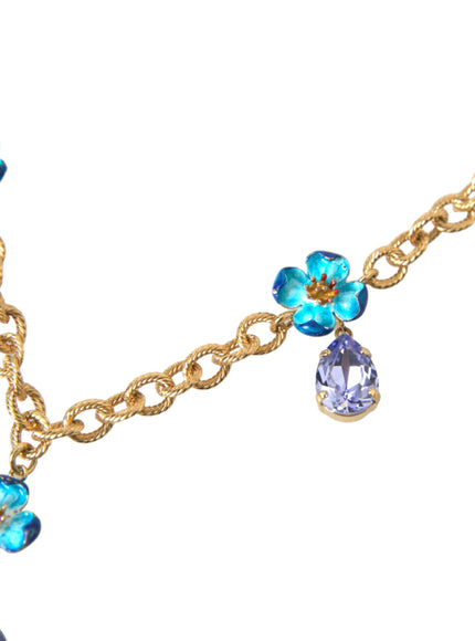 a necklace with a blue flower and a blue crystal