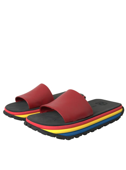 a pair of red and yellow sandals on a white background