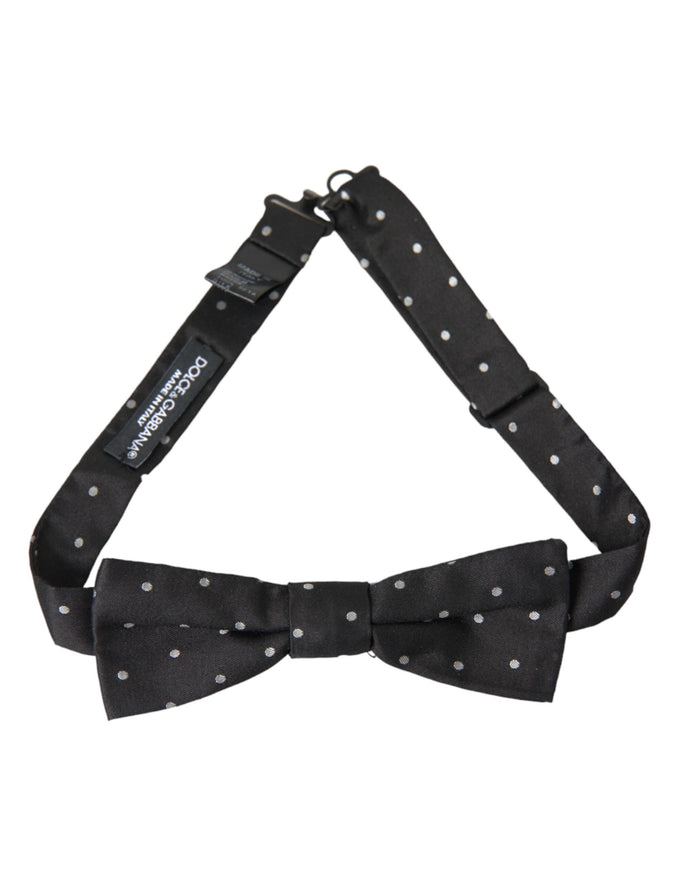 a black bow tie with white polka dots