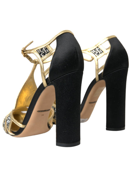 a pair of black and gold high heels