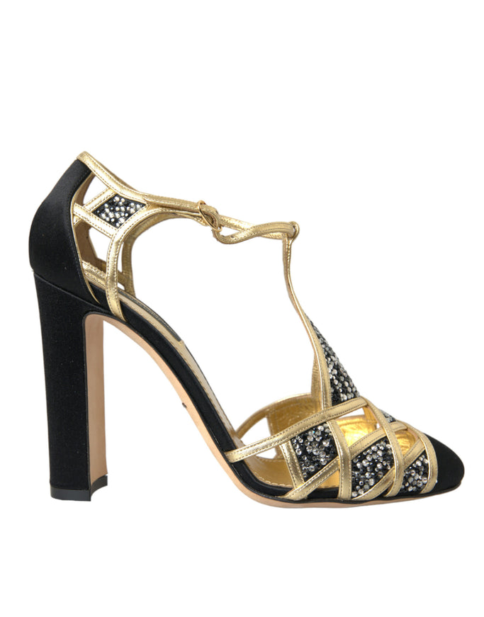 a pair of black and gold high heels