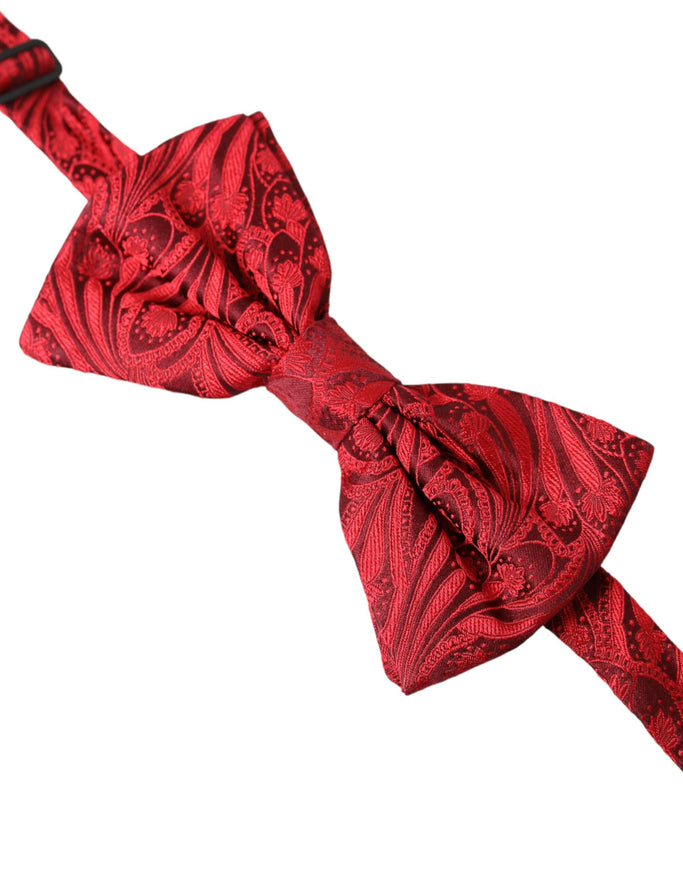 a close up of a red bow tie on a white background