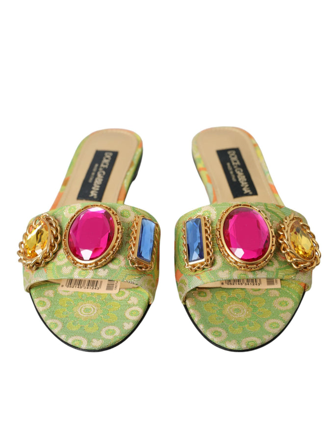 a pair of shoes with colorful stones on them