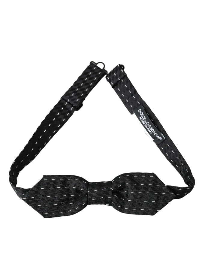 a black bow tie with white dots on it