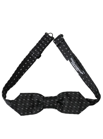 a black bow tie with white dots on it