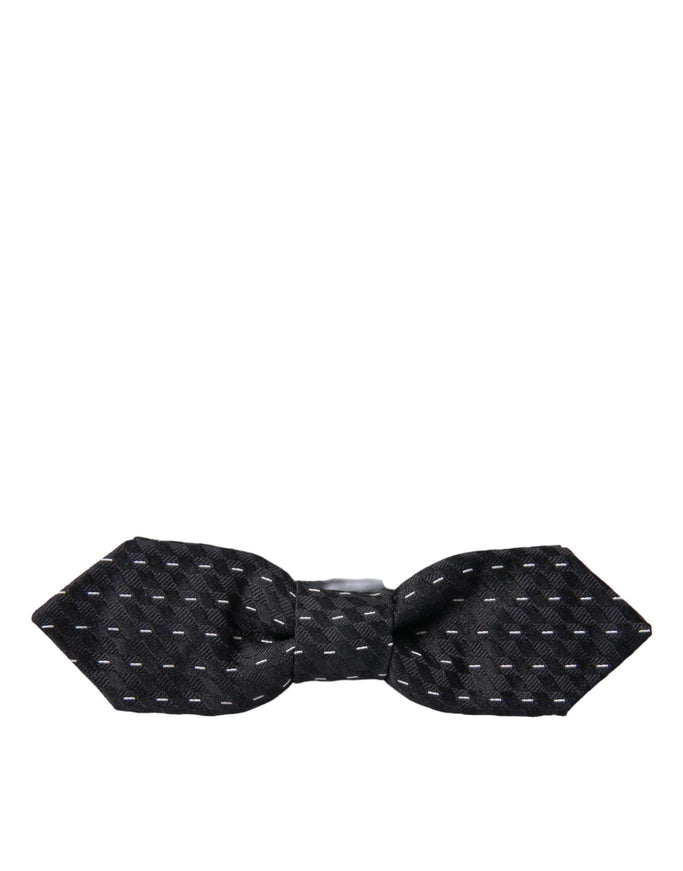 a black and white bow tie on a white background