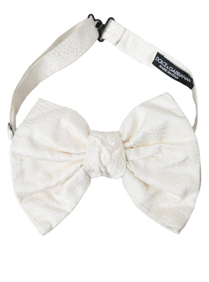 a white bow tie on a white headband