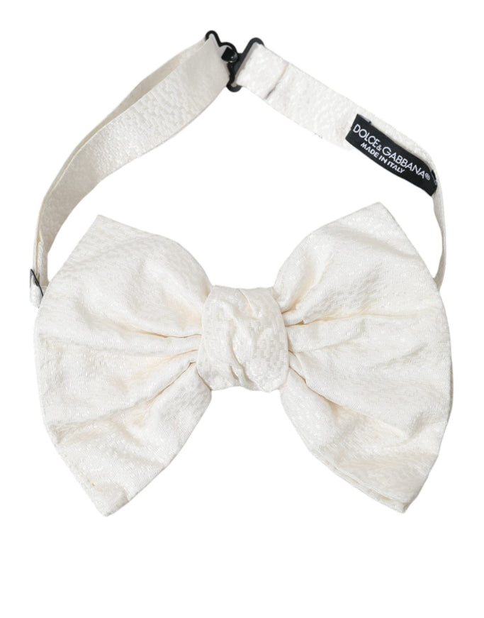 a white bow tie on a white headband