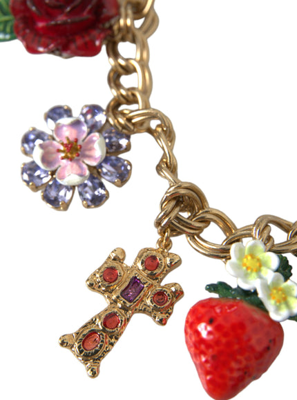 a cross, a strawberry and a flower on a chain