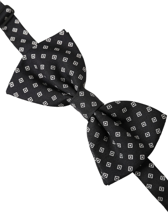 a black and white bow tie on a white background