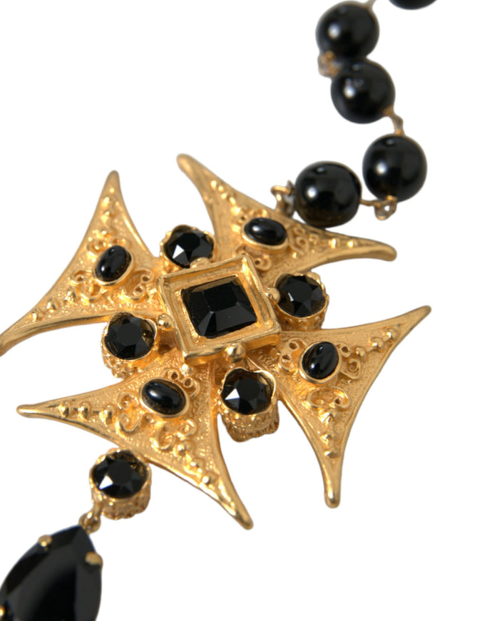 a black and gold necklace with a star design