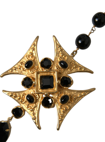 a black and gold necklace with black beads