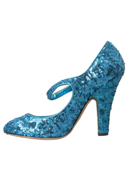 a pair of blue high heeled shoes on a white background