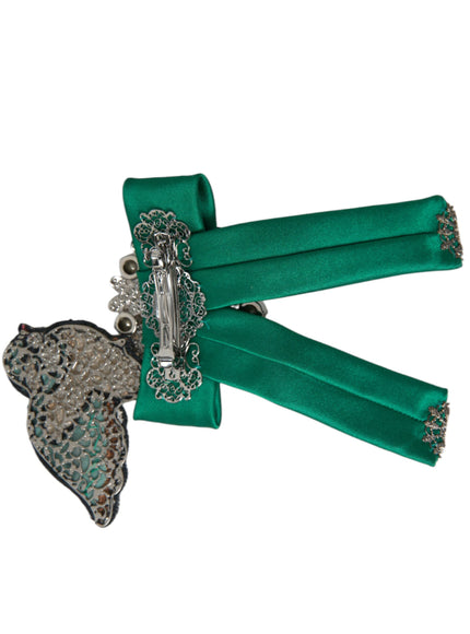 a pair of green garters with a brooch