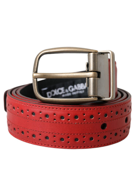 a red belt with holes and a metal buckle