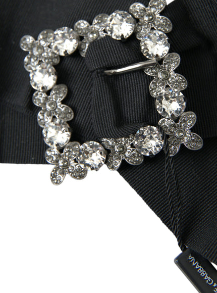 a close up of a tie with a brooch on it