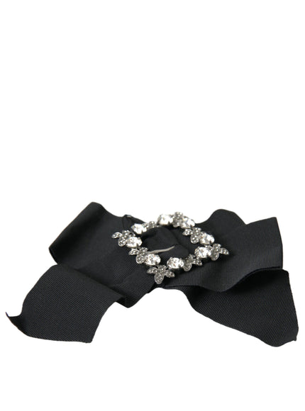 a close up of a black ribbon with a bow