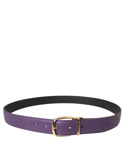 a woman wearing a purple belt with a gold buckle