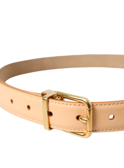 a tan leather belt with a gold buckle