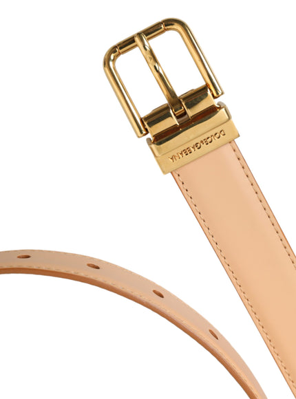 a tan belt with a gold buckle