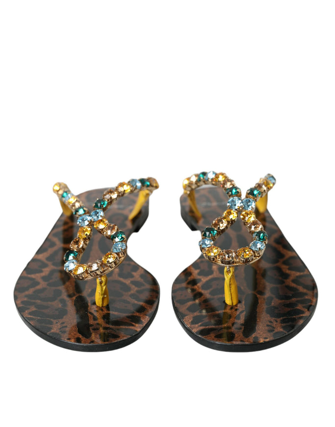 a pair of leopard print sandals with jewel accents