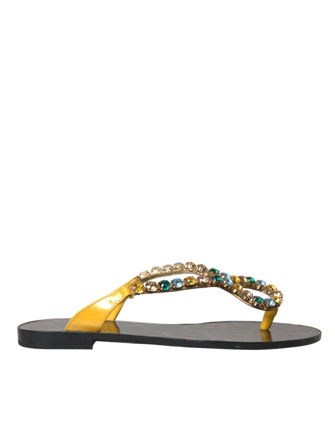 a pair of sandals with beaded straps