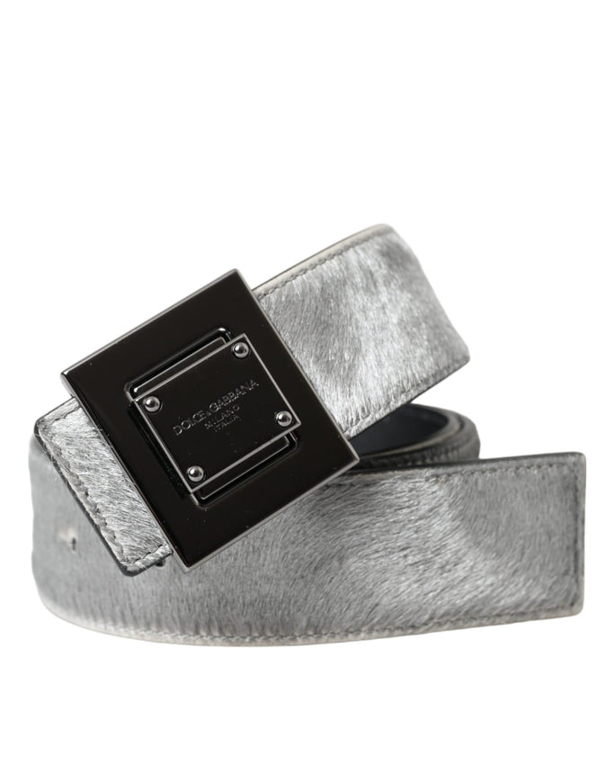 a silver belt with a black square buckle