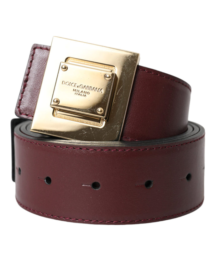 a red belt with a gold buckle on it