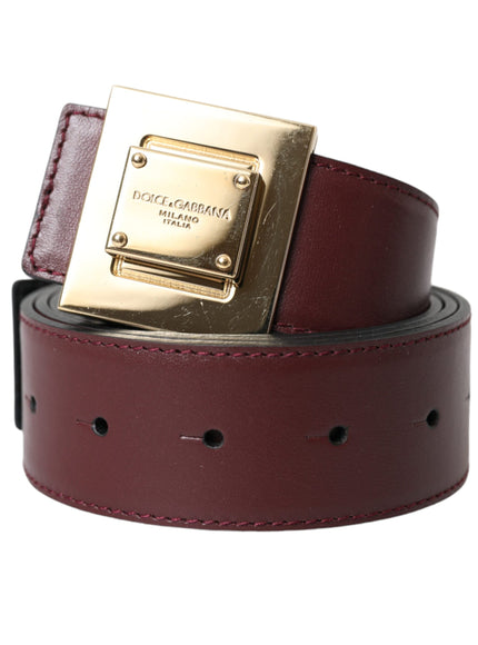 a red belt with a gold buckle on it