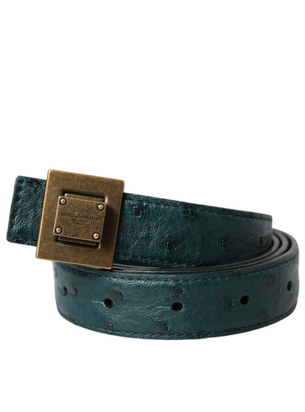 a green belt with a gold buckle on it