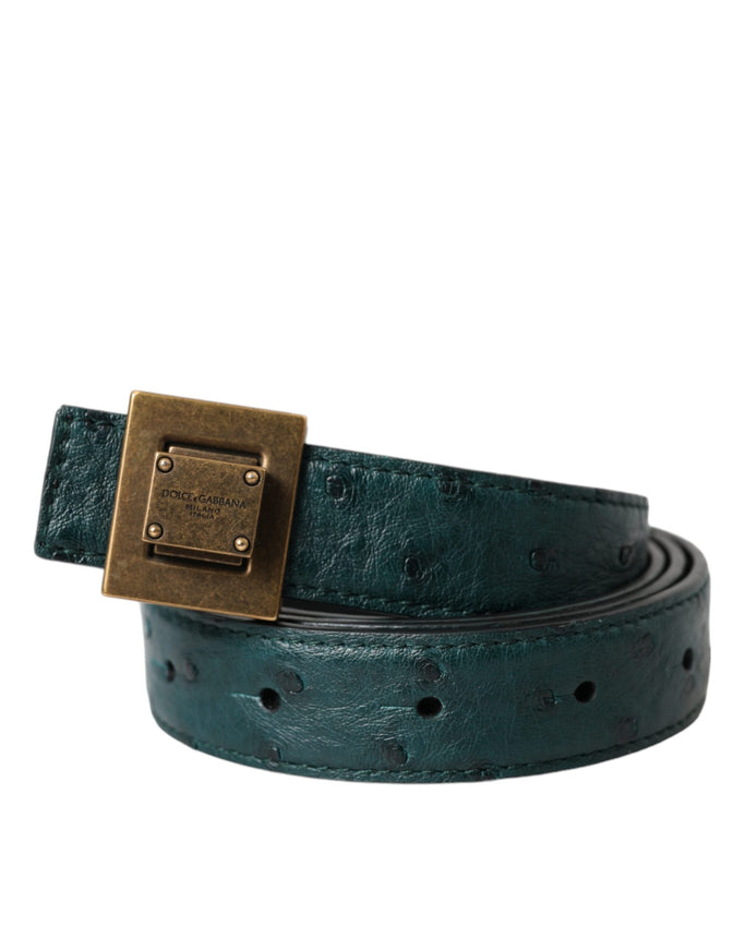 a green belt with a gold buckle on it