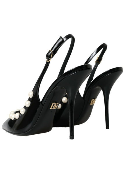 a pair of black high heels with pearls