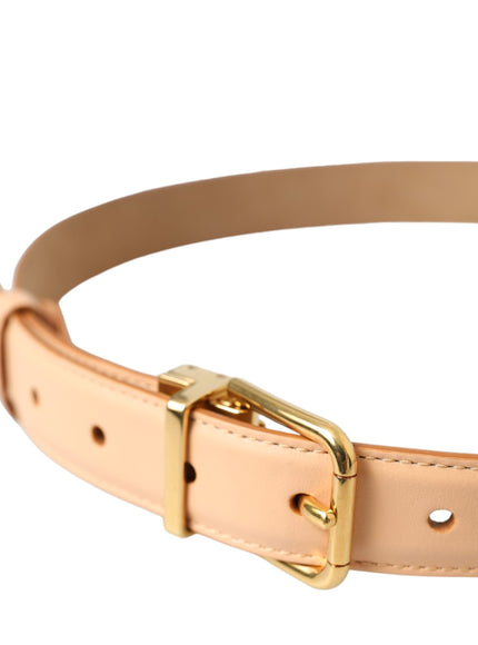 a tan leather belt with a gold buckle