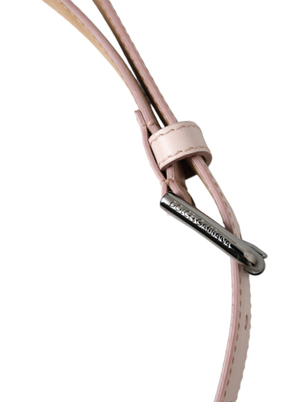 a close up of a pink leather cord