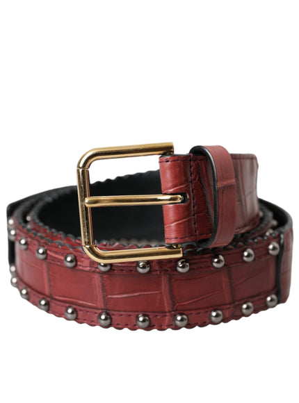 a red leather belt with a gold buckle