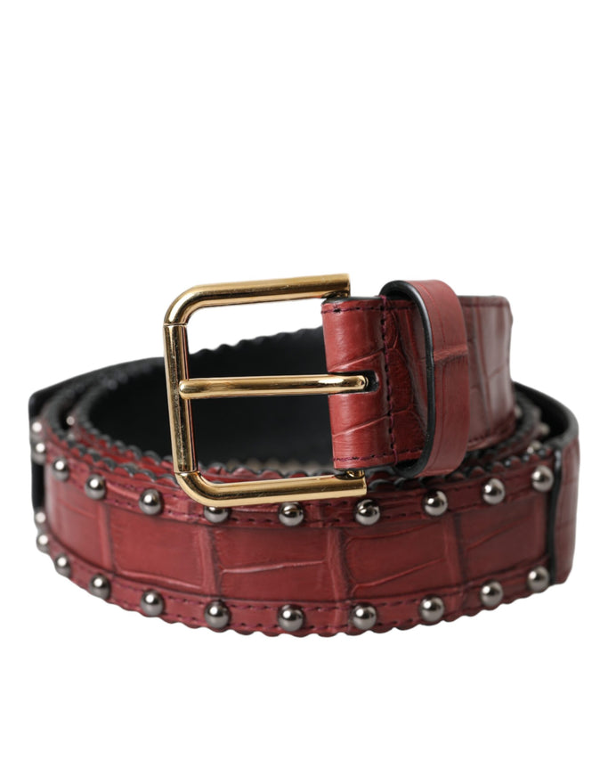 a red leather belt with a gold buckle