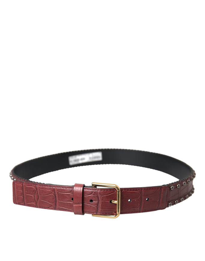 a women's leather belt with a gold buckle