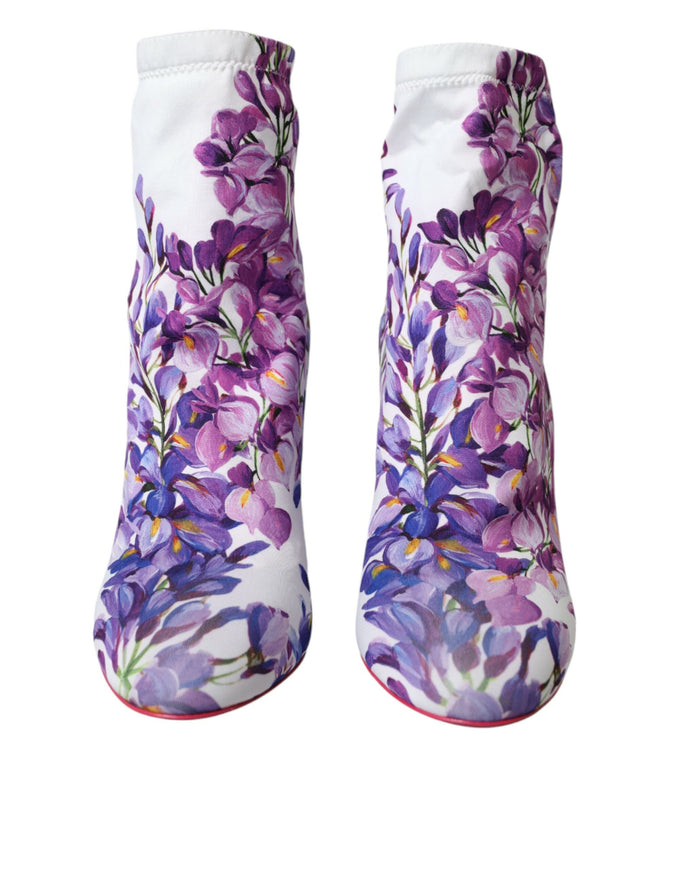 a pair of boots with purple flowers painted on them